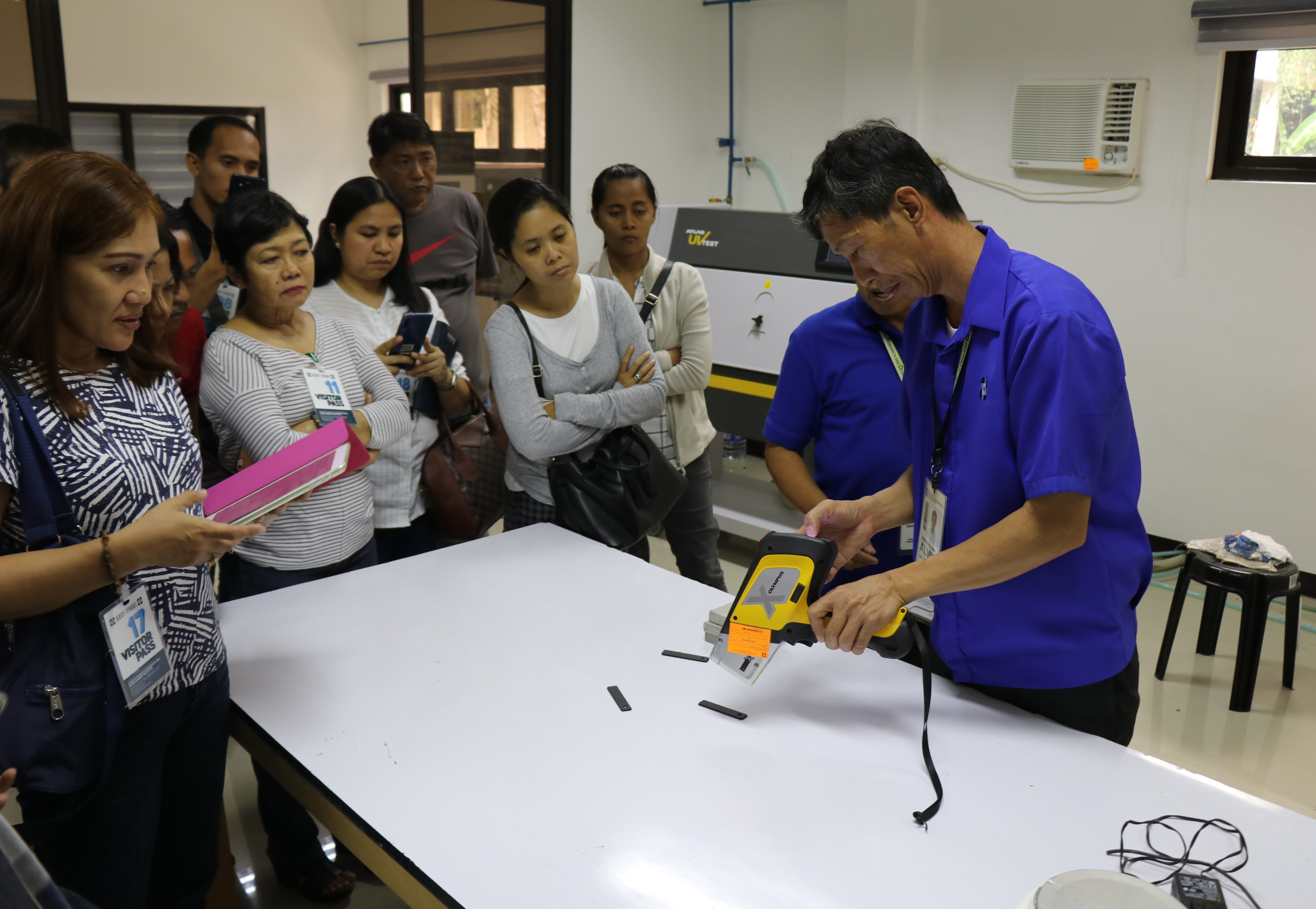 Engr. Vardeleon demonstrates how to use the X-Ray Fluorescence (XRF) device to measure lead content in paint applied to furniture.