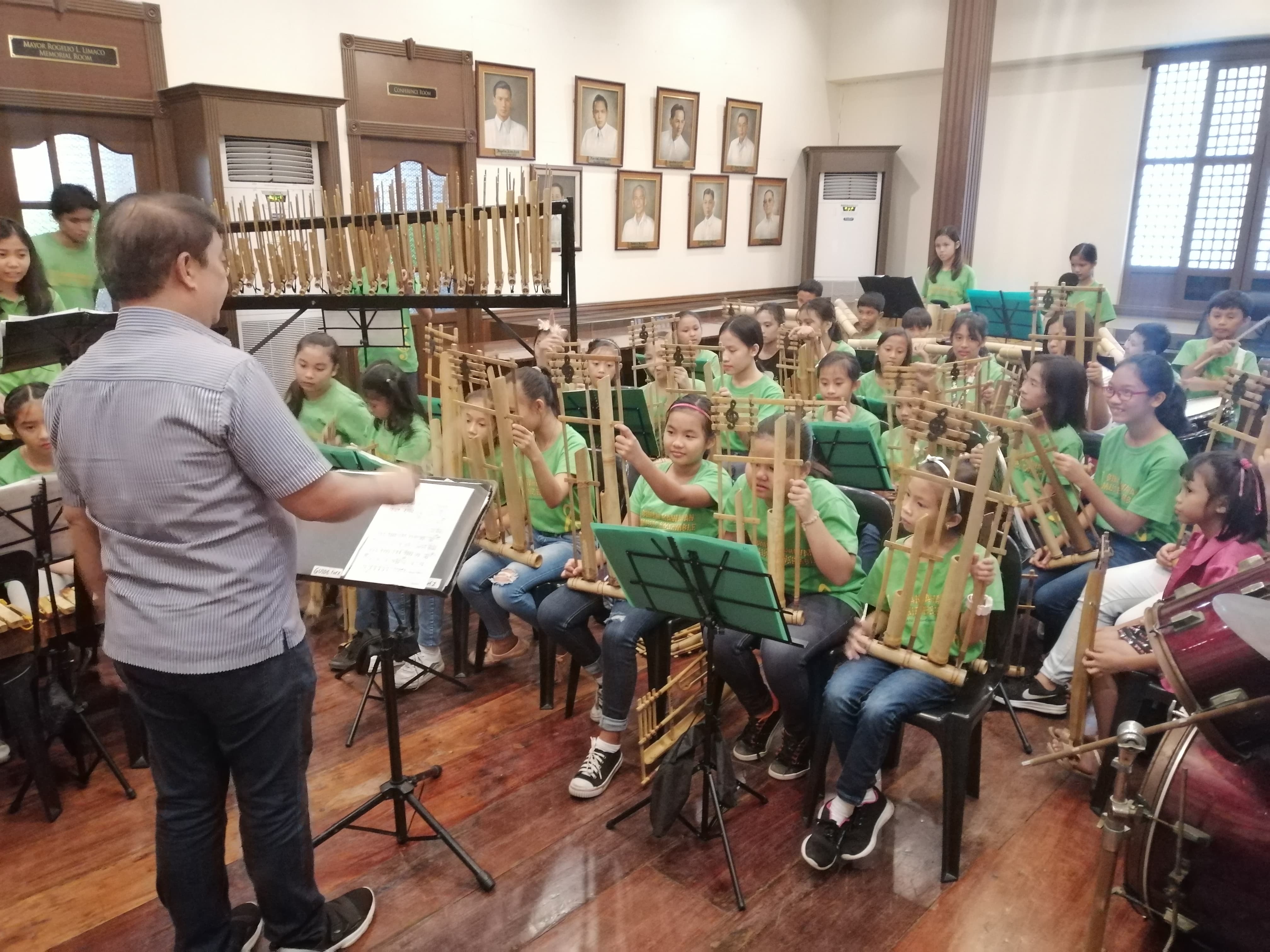 Apart from being the conductor and musical director of Musikawayan, Ramos also trains members of the Binan Kawayan Music Ensemble