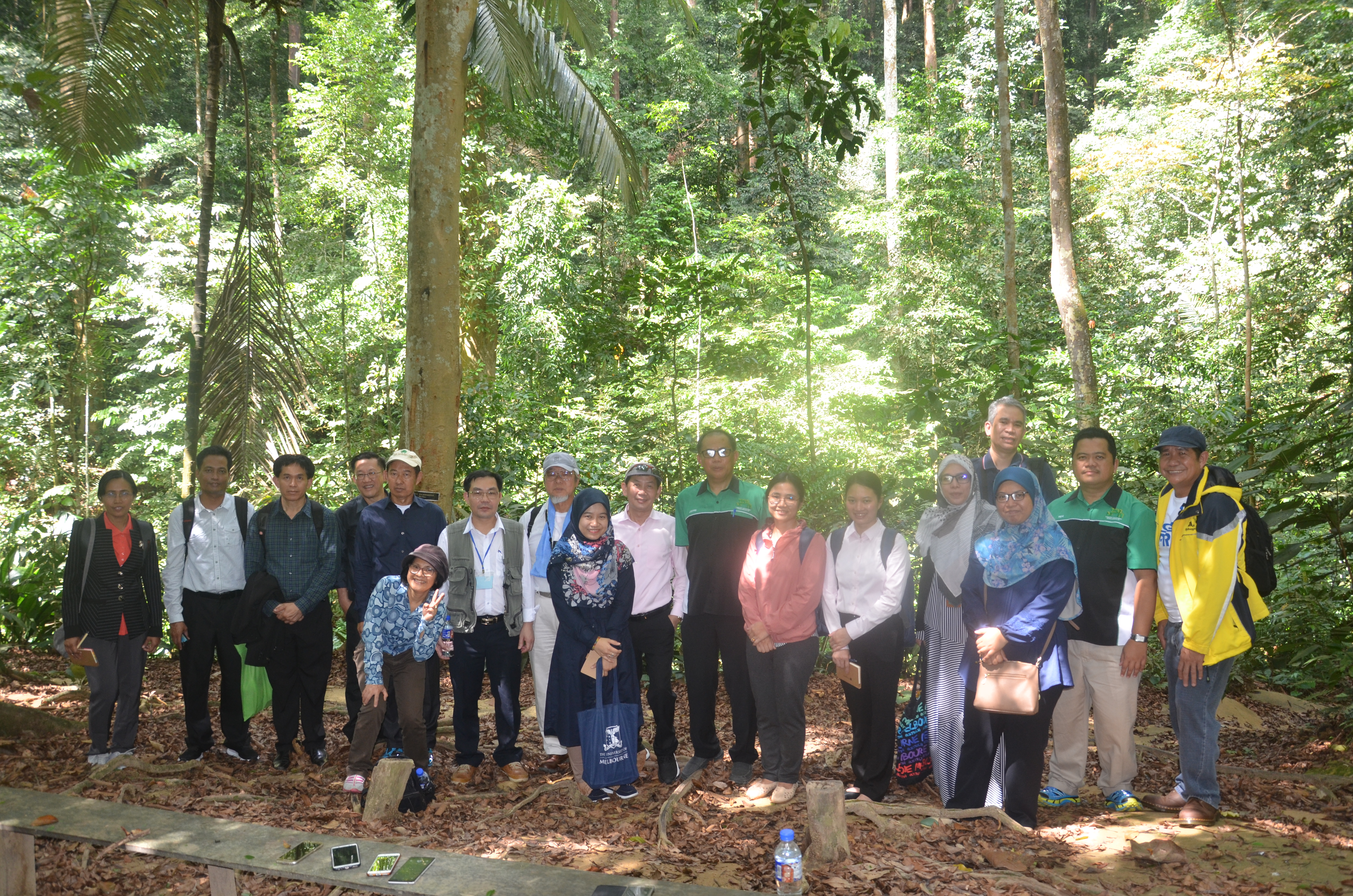 DOST-FPRDI’s Pitargue (in yellow jacket) and Estudillo (tallest) join other delegates in a study tour at FRIM forests last 23 January 2019