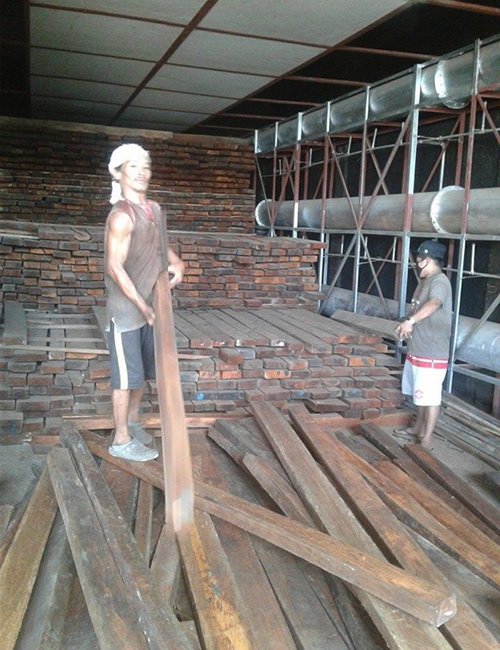 Inside Mr. Sumampong's furnace-type lumber dryer.